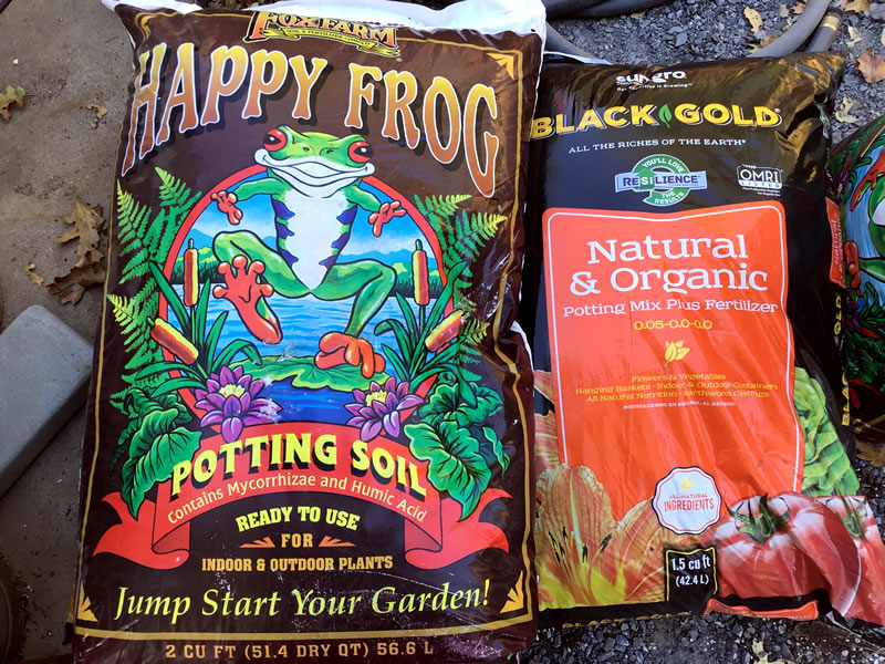 Bags of gardening soil, Black Gold, Happy Frog