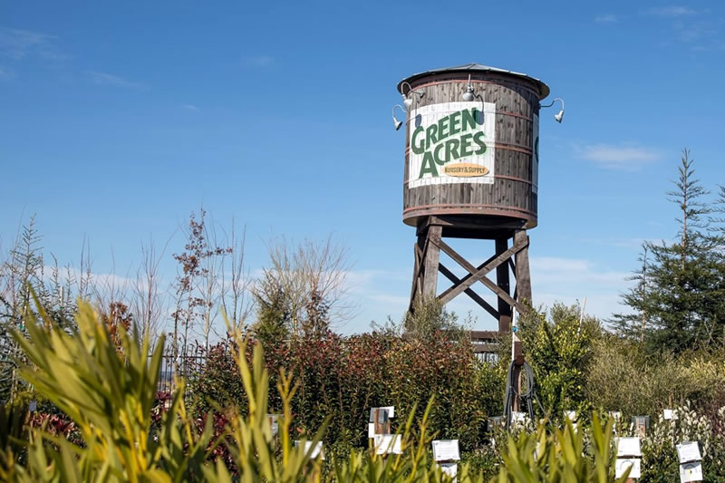 Watertower with Green Acres logo painted on the side