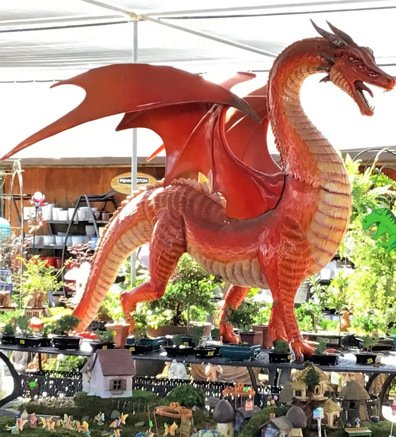 Large metal dragon with wings, garden art