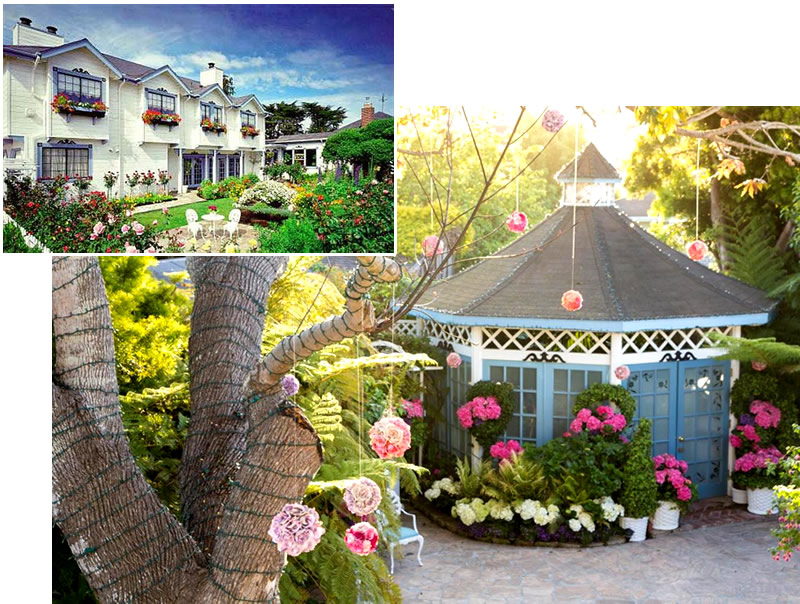 Garden gazebo, enclosed by walls and encircled by flowers.