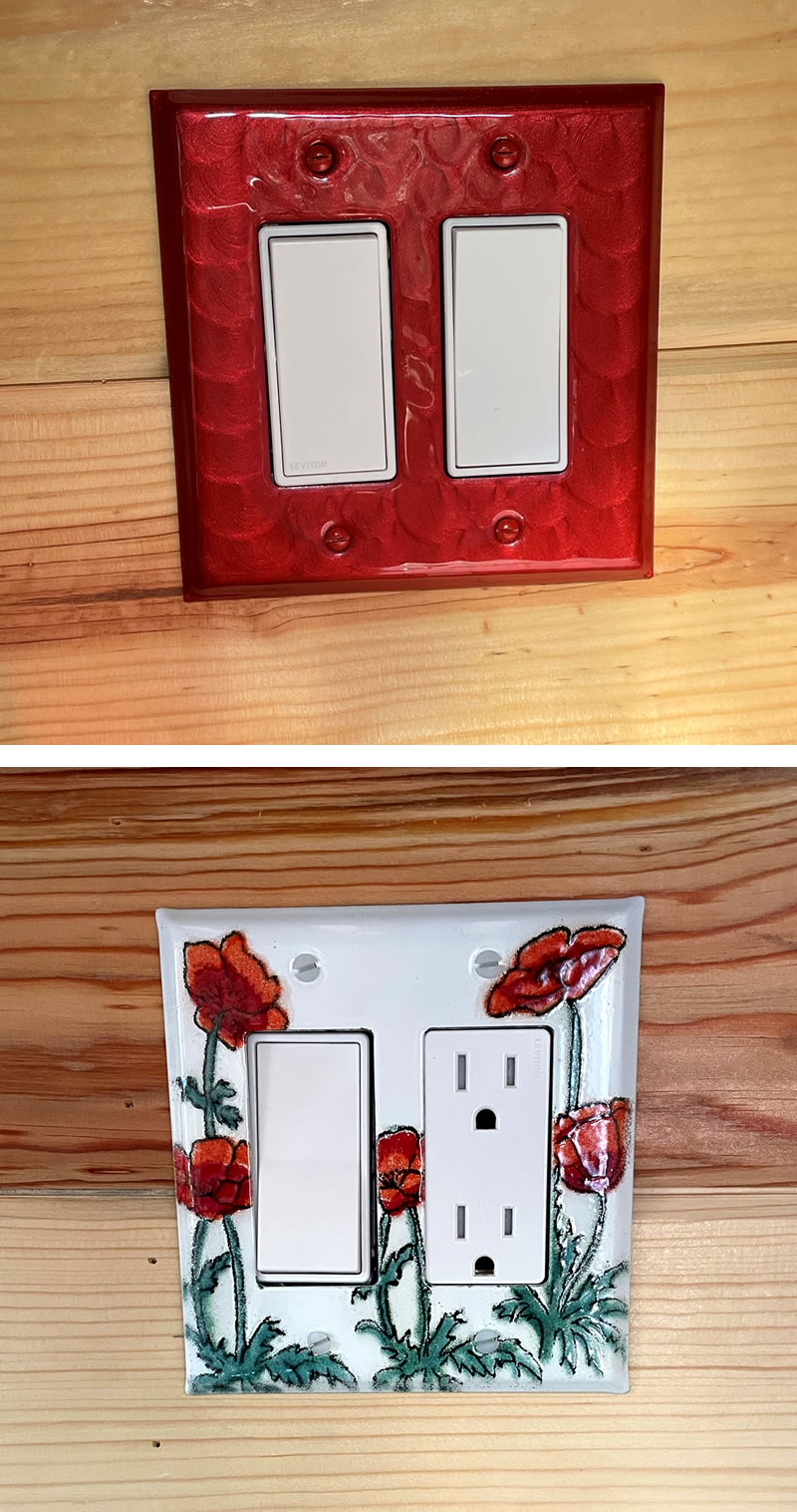 Two wall switchplates for turning on lights, one solid red, the other with red flower art.